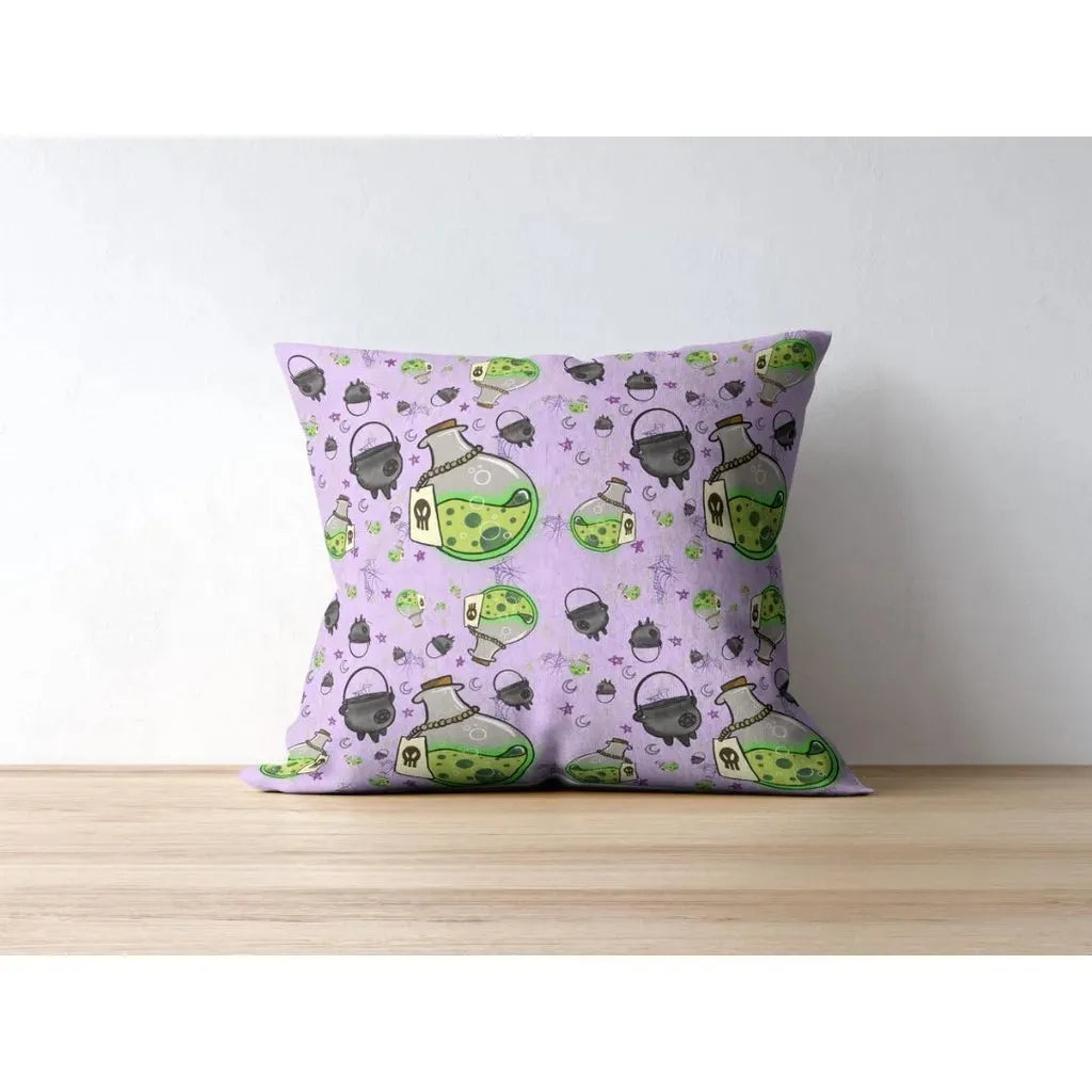 Square throw pillow mockup displaying a repeating spooky witchy pattern of green potions and black cauldrons.