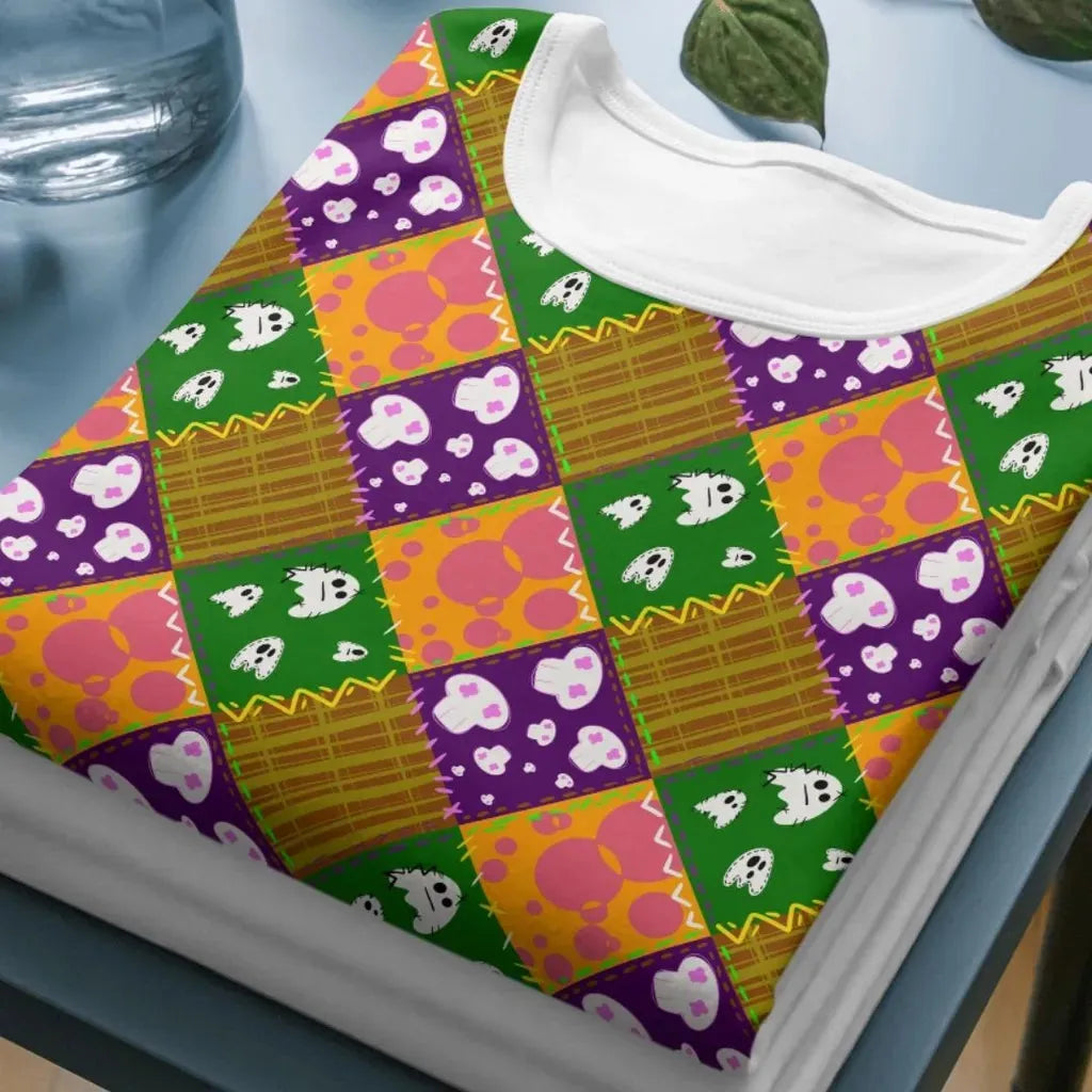 Mockup of a t-shirt showing the all-over print of the patchwork skulls seamless design, ideal for sublimation or DTG printing.