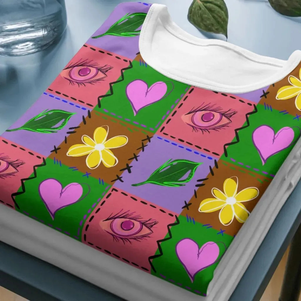 T-shirt mockup displaying the quilt patchwork seamless pattern with vibrant hand-drawn block designs.