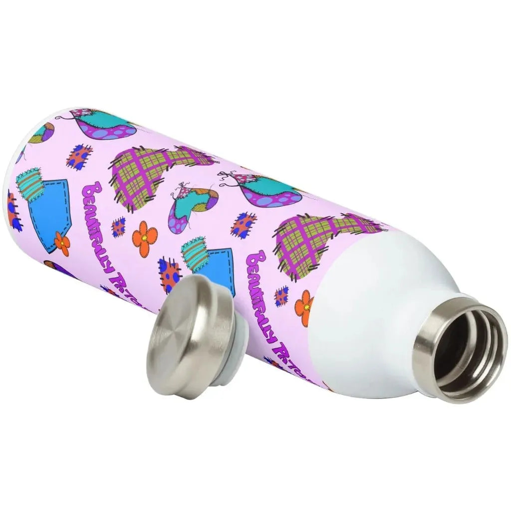 Water bottle mockup featuring the Beautifully Patched seamless pattern wrapped around the bottle.