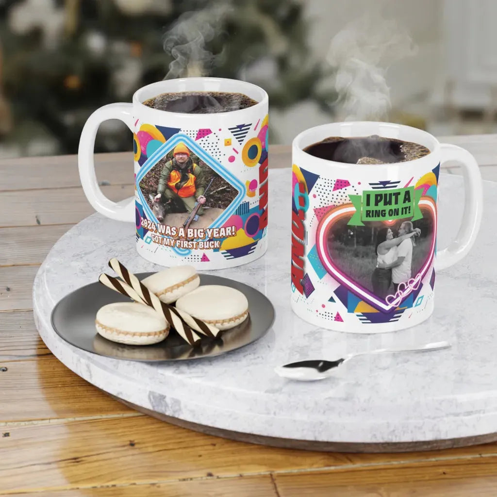 Two personalized ceramic mugs with colorful dog designs, steaming coffee inside, on a marble tray with cookies.