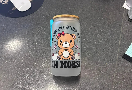 Eco-friendly glass can cup with bamboo lid, metal straw, and cartoon bear saying "I'm not like other girls."